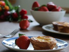 A dessert plate with a tart and strawberry at The Old Post Box in 