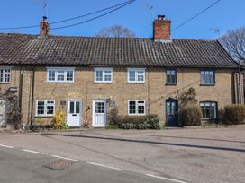 A row of houses with windows and doors at The Old Post Box in Halesworth