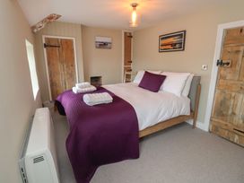 A bedroom with a bed and towels at 6 Gravel Hill in King's Lynn
