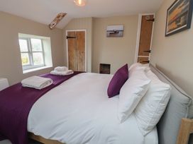 A bedroom with a bed and window at 6 Gravel Hill King's Lynn