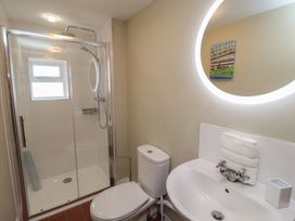 A bathroom with a shower and sink at 6 Gravel Hill in King's Lynn