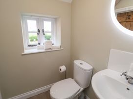 A bathroom with a sink and toilet at 6 Gravel Hill in King's Lynn