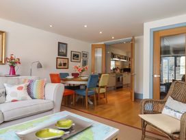 A living room with a dining area and kitchen visible at 26 Dart Marina 