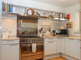 A kitchen with stove and microwave at 26 Dart Marina