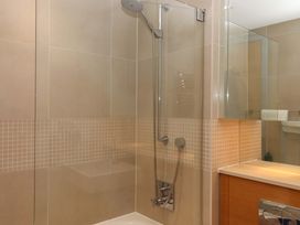 A bathroom with a shower and sink at 26 Dart Marina 