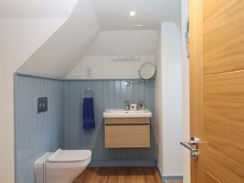 A bathroom with a sink and toilet at 26 Dart Marina