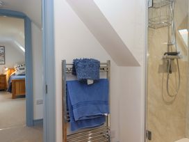 A bathroom featuring a towel rack and shower at 26 Dart Marina