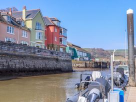 A view of houses and boats along the river at 26 Dart Marina