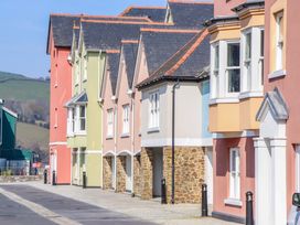 A row of houses with varying colors in a residential area at 26 Dart Marina