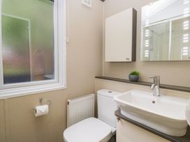 A bathroom with a sink and toilet at Feather Hill Lodge in Windermere