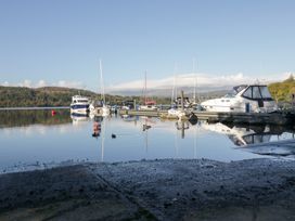 A marina with boats on the water at Feather Hill Lodge near White Cross Bay near Troutbeck Bridge