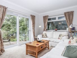 A living room with a sofa and coffee table at Mayflower View in Dawlish
