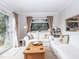 A living room with a sofa and coffee table at Mayflower View Dawlish