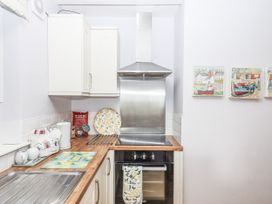 A kitchen with an oven and extractor hood at Mayflower View in Dawlish