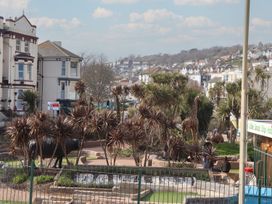 A view of a park with animal statues and landscaping at Mayflower View, Dawlish