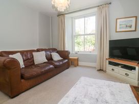 A living room with a sofa and television at Pedn Brose Near Mousehole