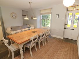A dining room with a table and chairs at Pedn Brose near Mousehole