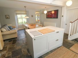 A kitchen with a table and chairs at Pedn Brose Near Mousehole