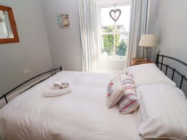 A bedroom with a bed and a nightstand at Pedn Brose near Mousehole