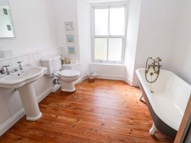 A bathroom with a bathtub and sink at Pedn Brose Near Mousehole