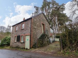 A stone house with stairs and landscaping at The Old Sunday School Cwmwysg near Sennybridge