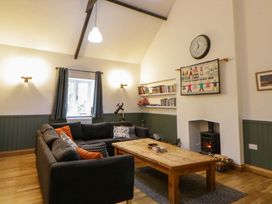 A living room with a sofa and coffee table at The Old Sunday School in Cwmwysg near Sennybridge