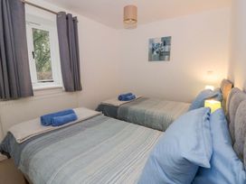 A bedroom with two beds and a window at The Old Sunday School in Cwmwysg near Sennybridge