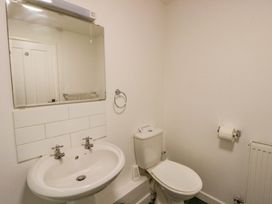 A bathroom with a wash basin and toilet at The Old Sunday School in Cwmwysg near Sennybridge