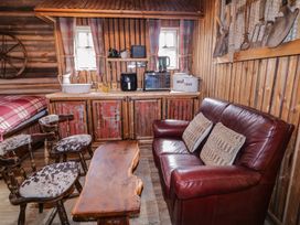 A living room with a sofa and coffee table at Rusty Barn in Limavady