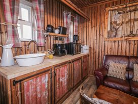 A kitchen with a sink and cabinets at Rusty Barn in Limavady