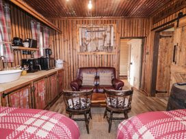 A living room with a sofa and chairs at Rusty Barn in Limavady