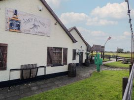 An outdoor bar with a cactus at Rusty Barn in Limavady