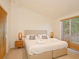 A bedroom with a bed and nightstand at Brayton in Aspatria