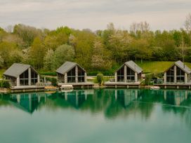 Three cabins by a lake at Brayton in Aspatria