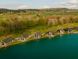 A row of cabins by a lake at Brayton in Aspatria