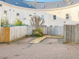 A garden area with a tree and pathway at Lisburne Place Torquay
