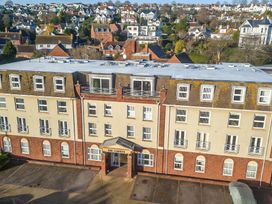 An exterior view of a building with balconies at The Degas Sea View Suite in Torquay