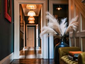 A hallway with a vase and pampas grass at St Anne's Manor in Torquay