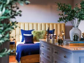 A bedroom with a bed and bedside lamps at St Anne's Manor in Torquay
