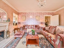 A living room with sofas and a coffee table at Muntham Luxury Town House with Hot Tub Torquay