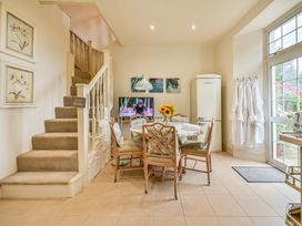 A dining room with a table and chairs at Muntham Luxury Town House with Hot Tub in Torquay