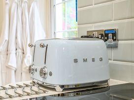 A toaster on the countertop in a kitchen at Muntham Luxury Town House with Hot Tub in Torquay