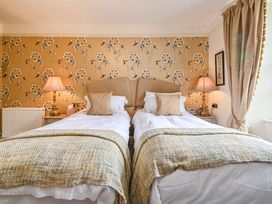 A bedroom with two beds and lamps at Muntham Luxury Town House with Hot Tub Torquay