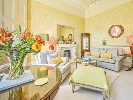 A living room with a sofa and coffee table at Muntham Deluxe Apartment 2 Torquay