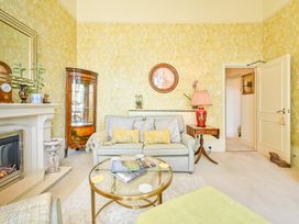 A living room with a sofa and coffee table at Muntham Deluxe Apartment 2 in Torquay