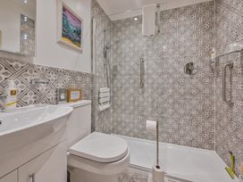 A bathroom with shower and sink at Muntham Deluxe Apartment 2 Torquay