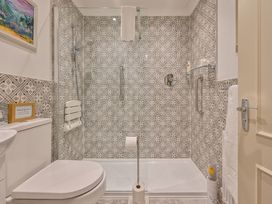 A bathroom with a shower and toilet at Muntham Deluxe Apartment 2 in Torquay