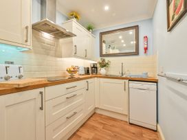 A kitchen with sink and appliances at Muntham Deluxe Apartment 3 in Torquay