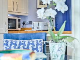 A kitchen with a microwave and toaster at Muntham Apartment 4 in Torquay