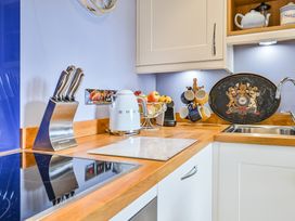 A kitchen with a knife block and kettle at Muntham Apartment 4 in Torquay